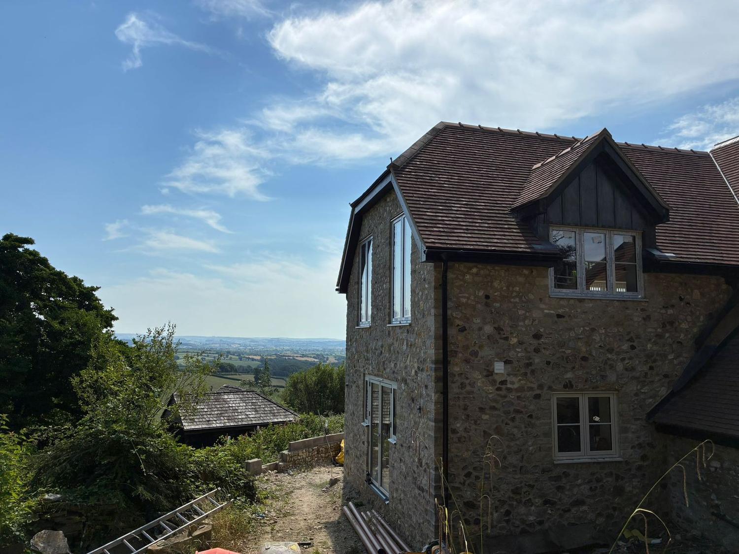 Stone-built new house by Chapman Building and Plastering above the Marshwood Vale, West Dorset