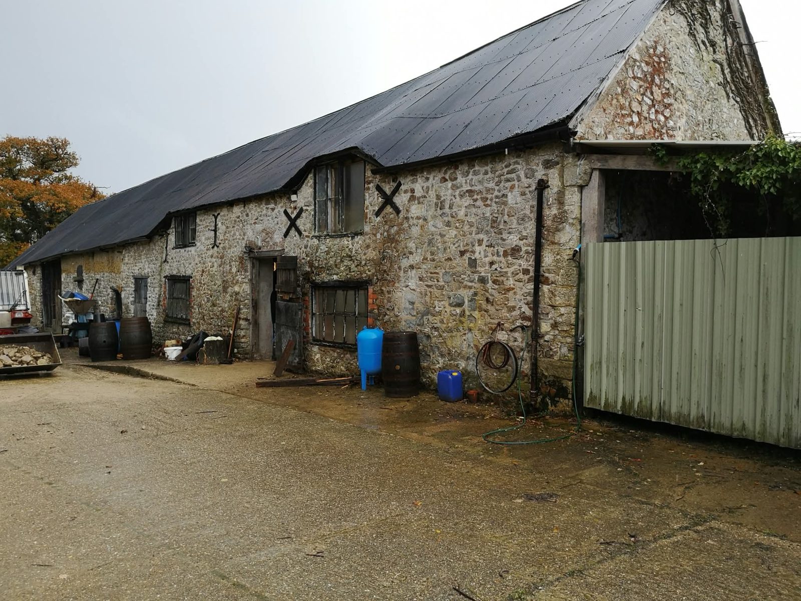 Stone barn with slate roof before conversion work started