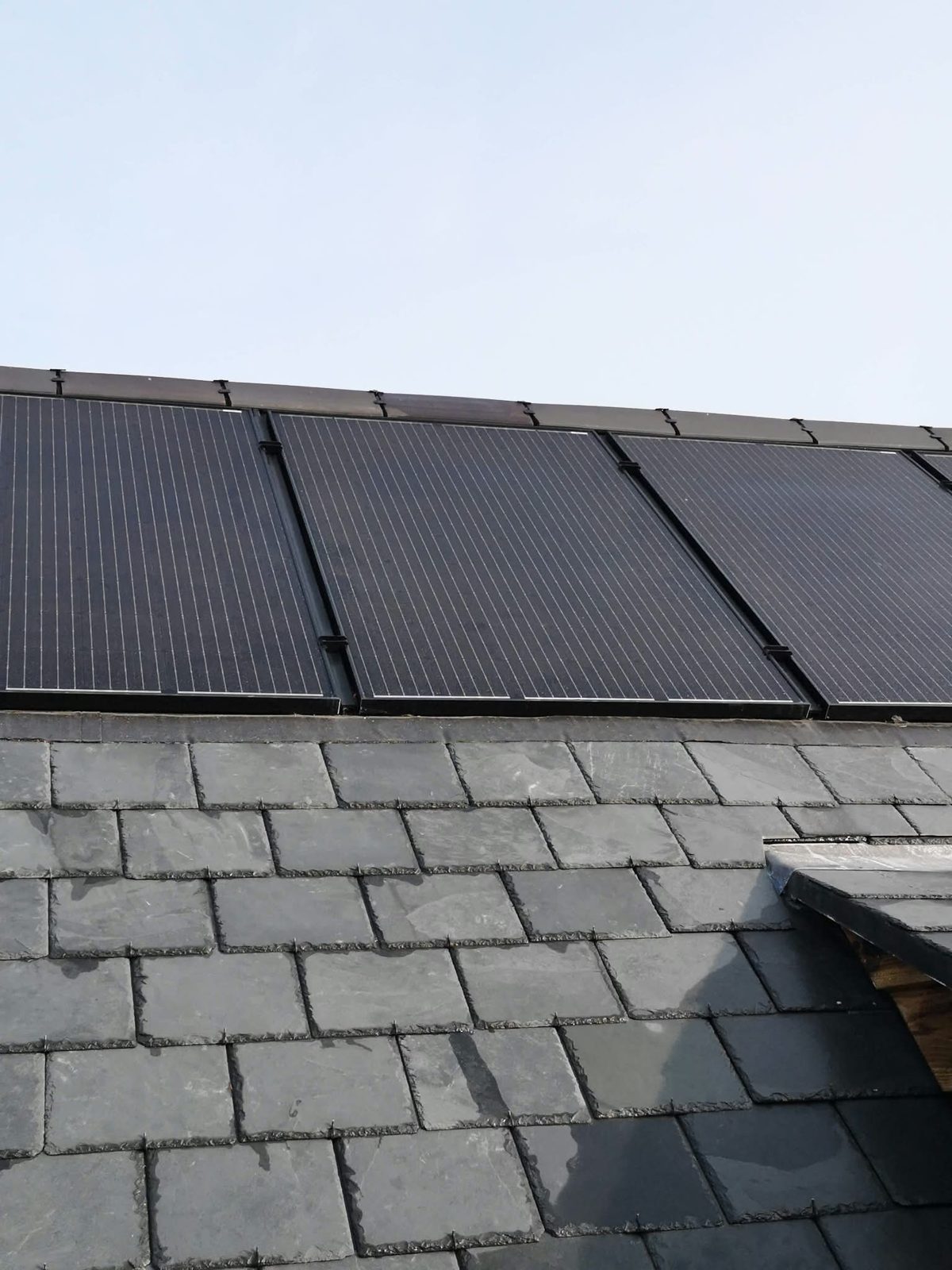 Solar panels set into a natural slate roof